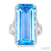 26x12 MM Emerald Cut Blue Topaz and 1/2 Ctw Round Cut Diamond Halo Semi-Precious Ring in 14K White Gold